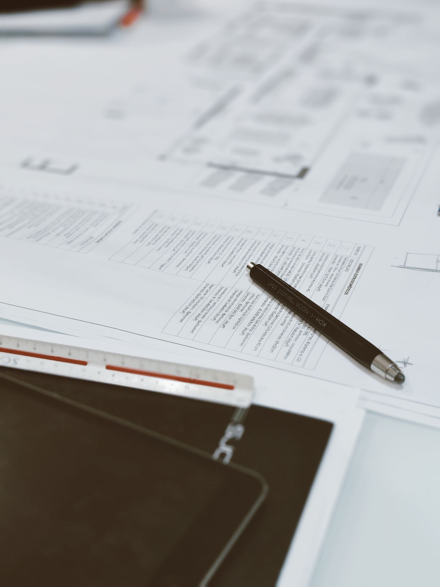 Permit plans and project paperwork on a worktable